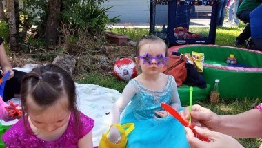 Chris Frost's daughter in an Elsa costume wearing star shaped sunglasses