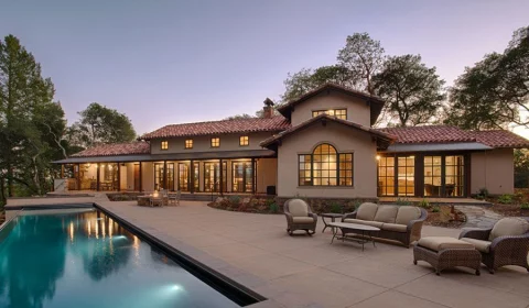 Staged backyard with pristine pool as represented by Total Concepts