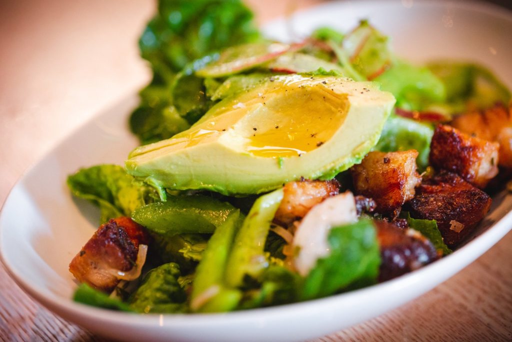 Delicious porkbelly and fresh avocado salad served at Perch + Plow