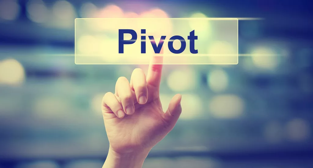 hand with finger pointing to the word pivot
